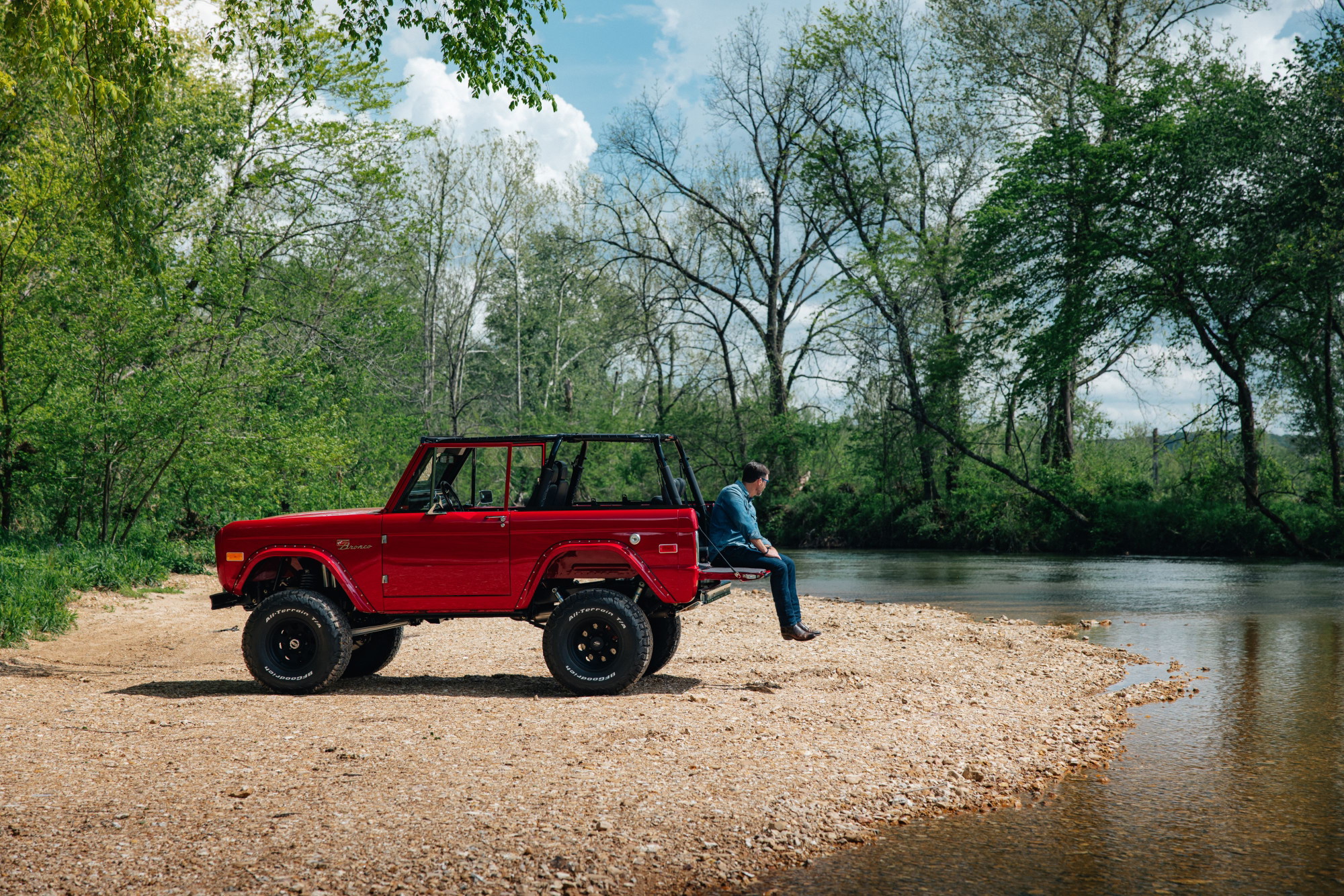 Red first-gen on the river bank. Photography: Britton Hardcastle.
