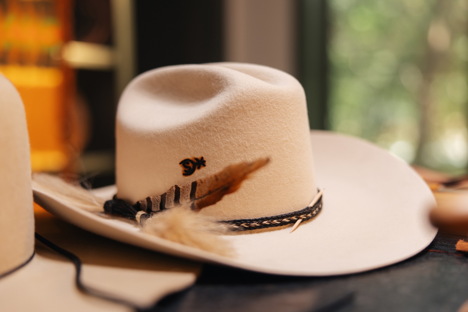 Branded crown, feather set.