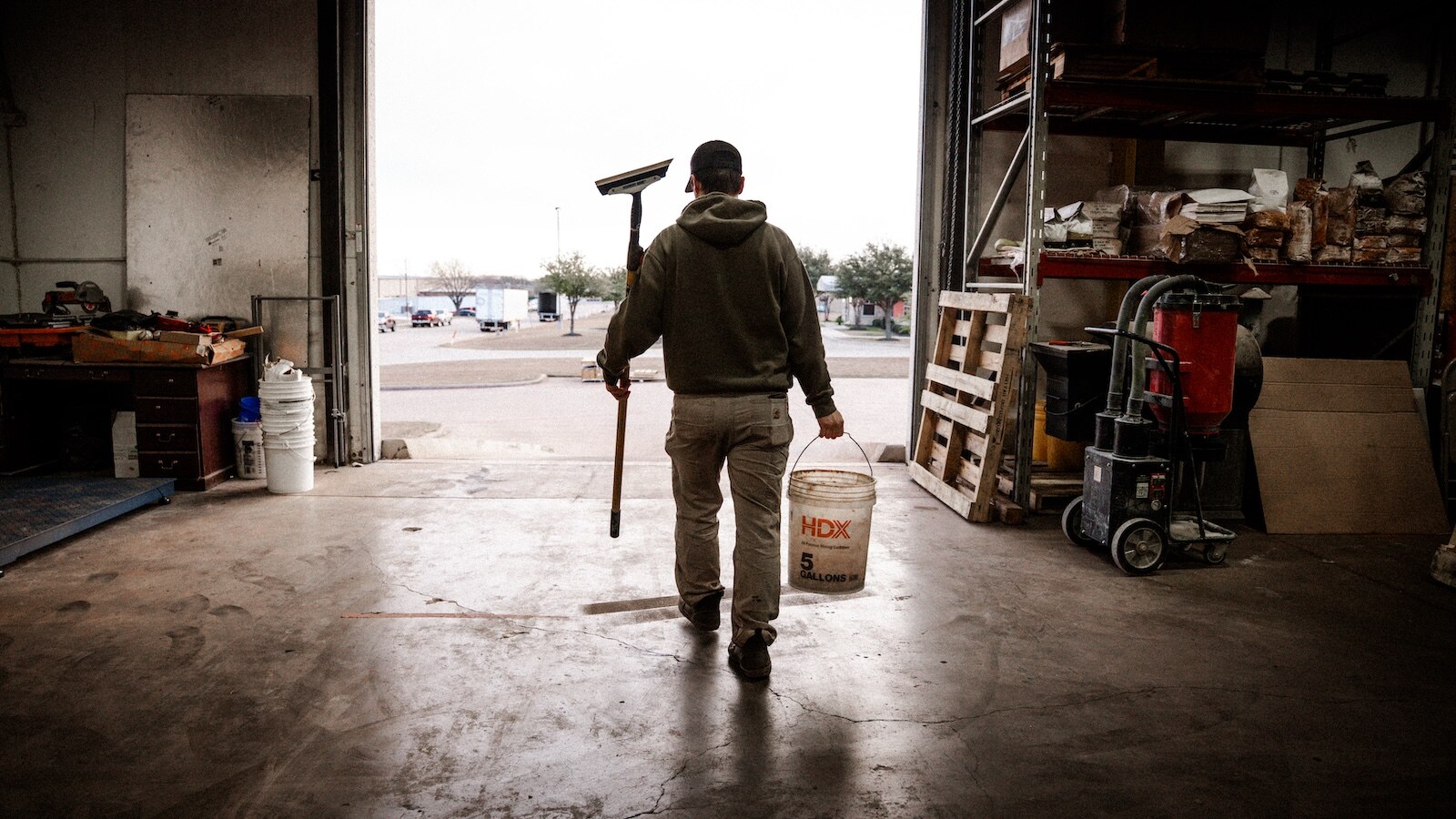 Between pours  -  bucket and squeegee headed back to the bay.