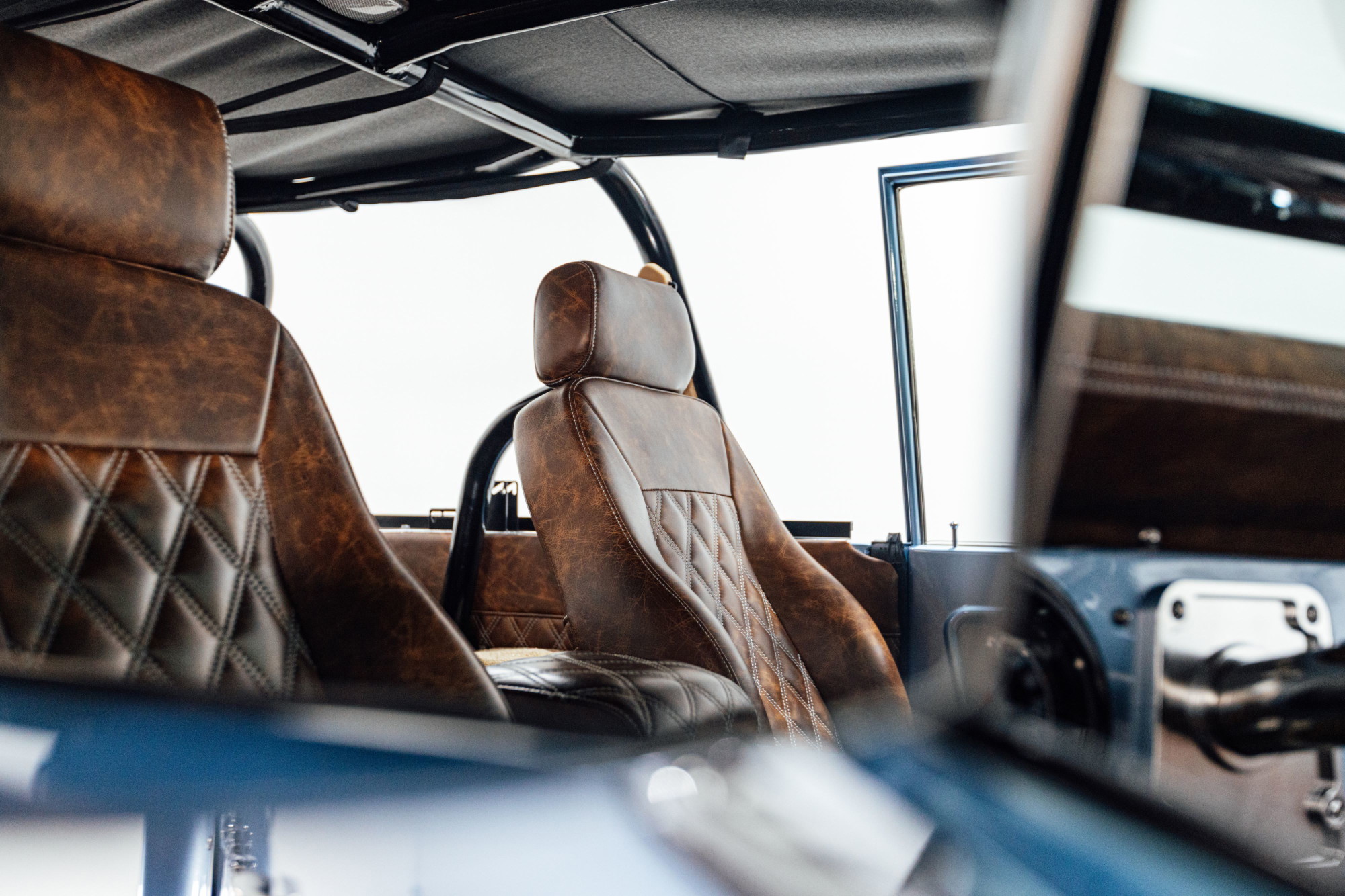 Diamond-stitched distressed leather and black soft top. Photography: Britton Hardcastle.