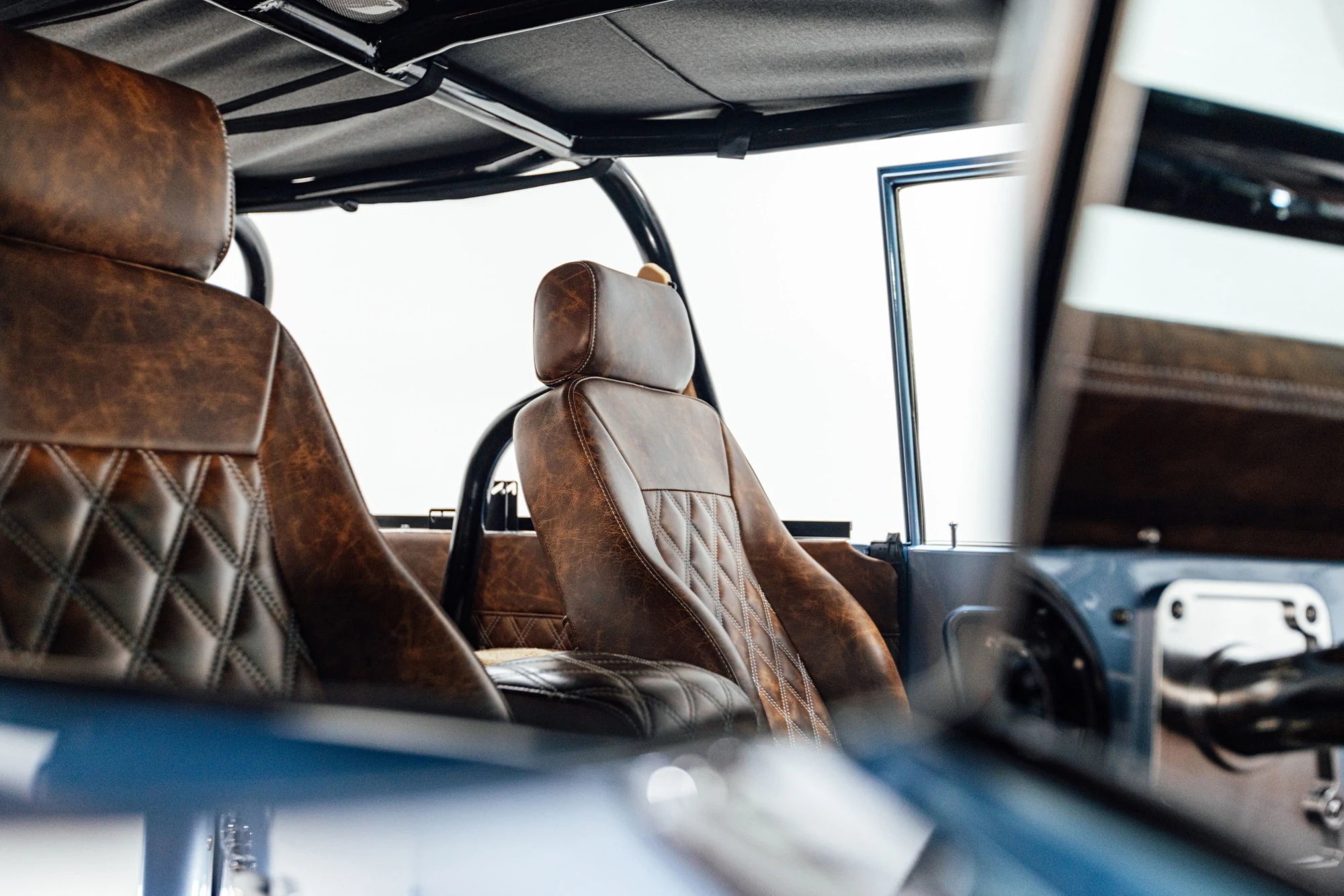 Diamond-stitched distressed leather and black soft top. Photography: Britton Hardcastle.