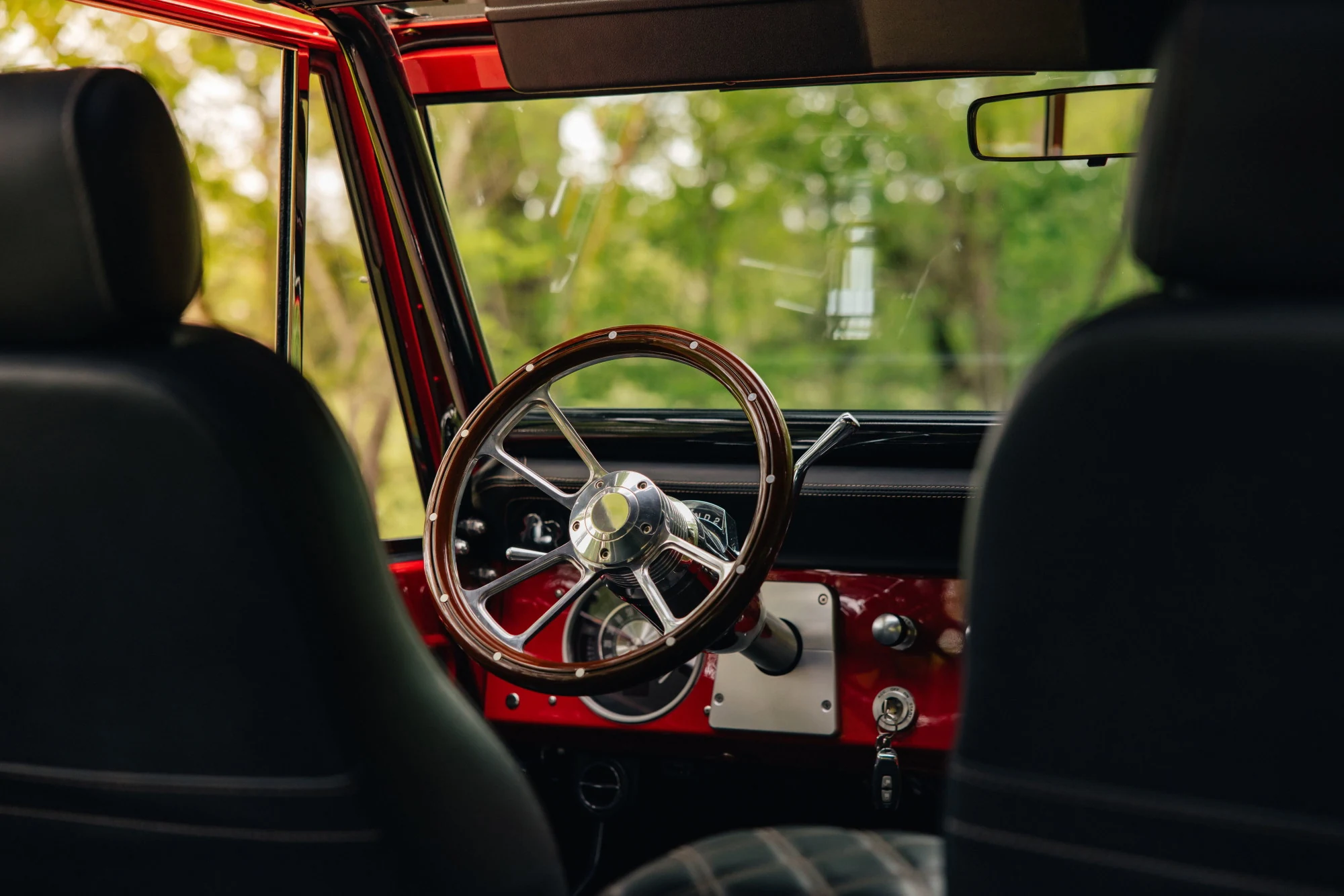1975 interior  -  wood-rimmed wheel, red dash. Photography: Britton Hardcastle.