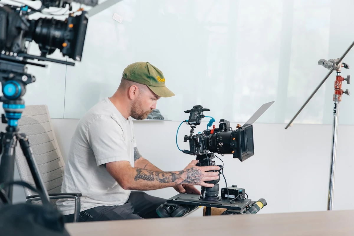 A Brand Hand cinematographer setting a shot